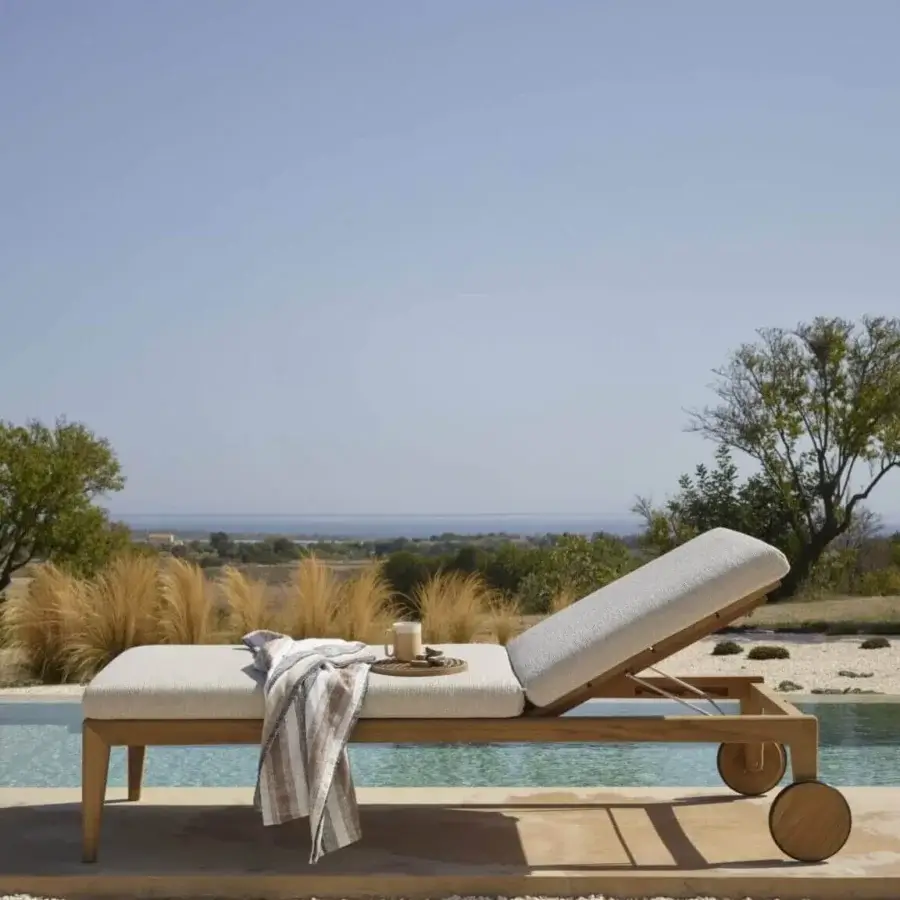 Exceptional Royal Botania Zenhit lounger built with teak wood and light gray textile upholstery for comfortable relaxation