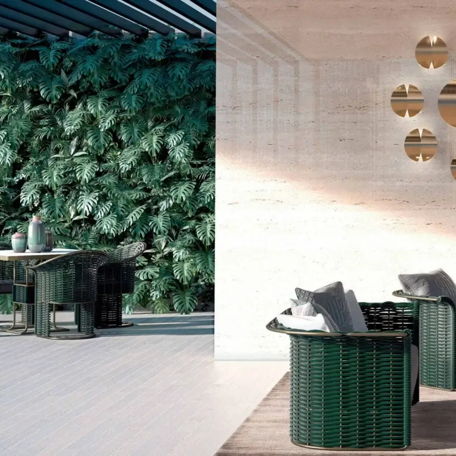 Distinguished Rugiano Marina armchair with Outdoor Bronze metal and dark green woven rope detailing, complemented by a light gray cushion
