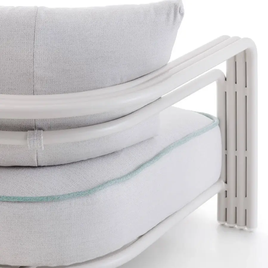 Lavish Rugiano Capri sofa with sleek metal frame and plush light gray cushions in sand finish
