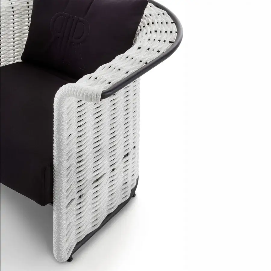 Lavish Rugiano Marina lounge chair with a black metal frame and white woven synthetic material complemented by dark textile cushions