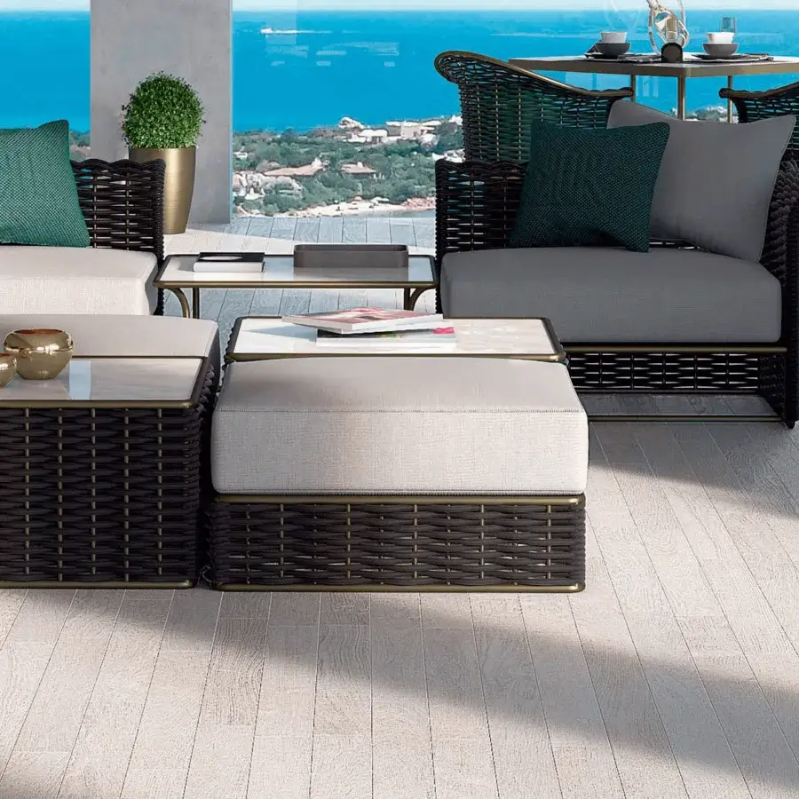 Superior Rugiano Marina ottoman with a woven dark brown base, off-white cushioned top and marble-patterned surface