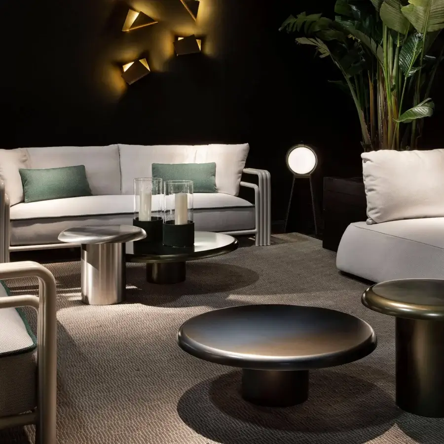 Exclusive Rugiano Elba coffee table crafted in dark grey metal with a sleek cylindrical base and circular tabletop