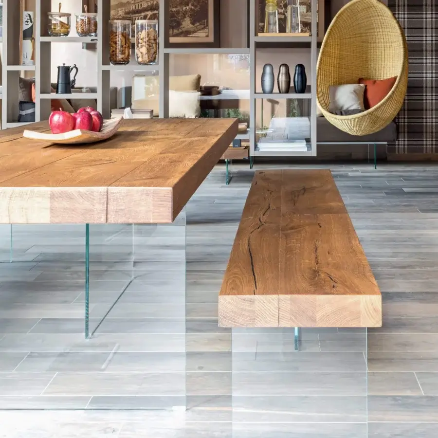 Distinguished Lago Air bench with a warm medium brown oak wood seat and clear glass supports crafted in Italy