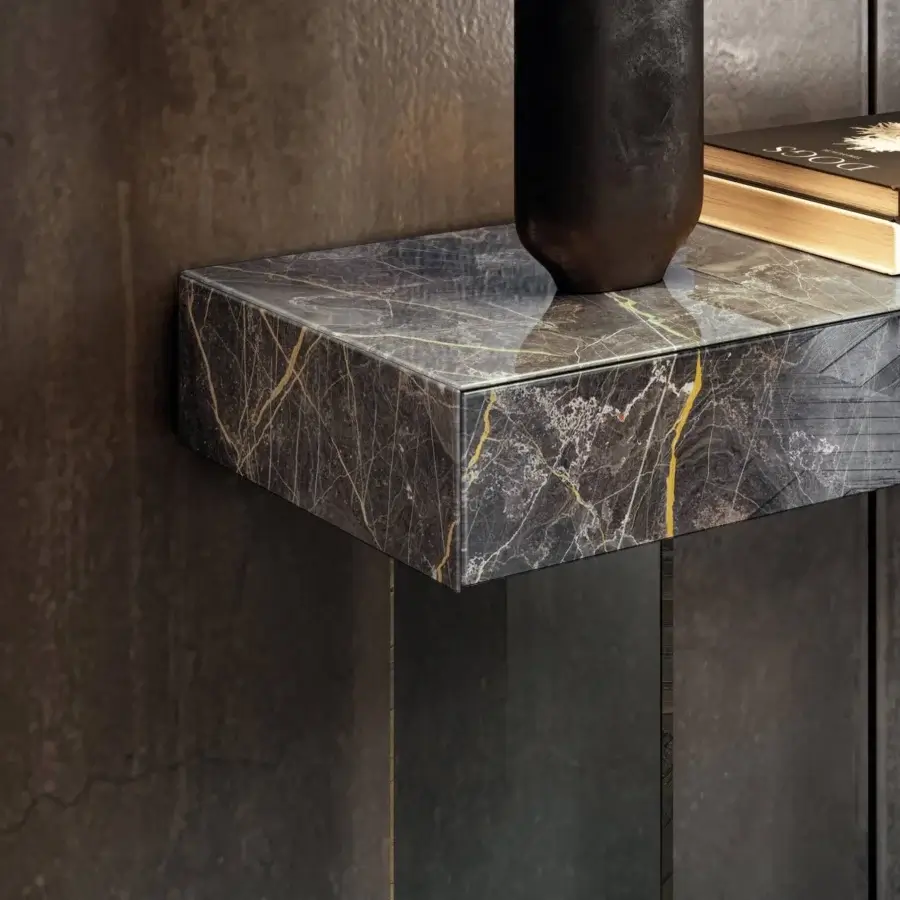 Distinguished Lago Materia console with monolithic silhouette clad in XGlass displaying dark marble-like veins and glossy finish