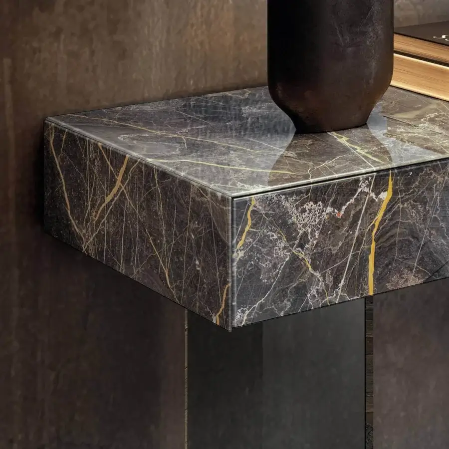 Superior Lago Materia console with monolithic form clad in dark gray XGlass exhibiting a glossy finish and see-through tempered glass sheets
