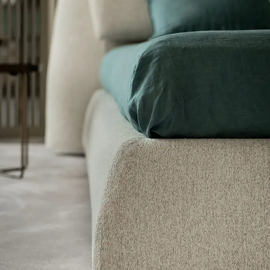 Distinguished Cattelan Italia Simon bed with folded headboard upholstered in textured light beige textile offering balanced design
