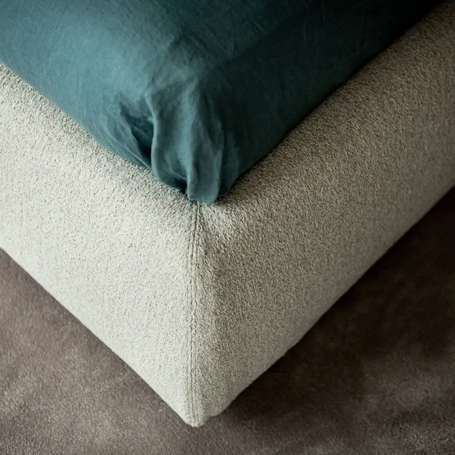 Lavish Cattelan Italia Simon bed with a curving headboard and balanced design in light beige textile upholstery