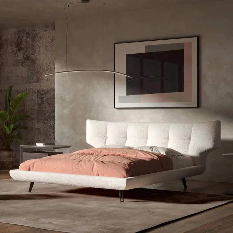 Distinguished Cattelan Italia Thomas bed with soft white upholstery and a quilted headboard supported by slender dark metal feet