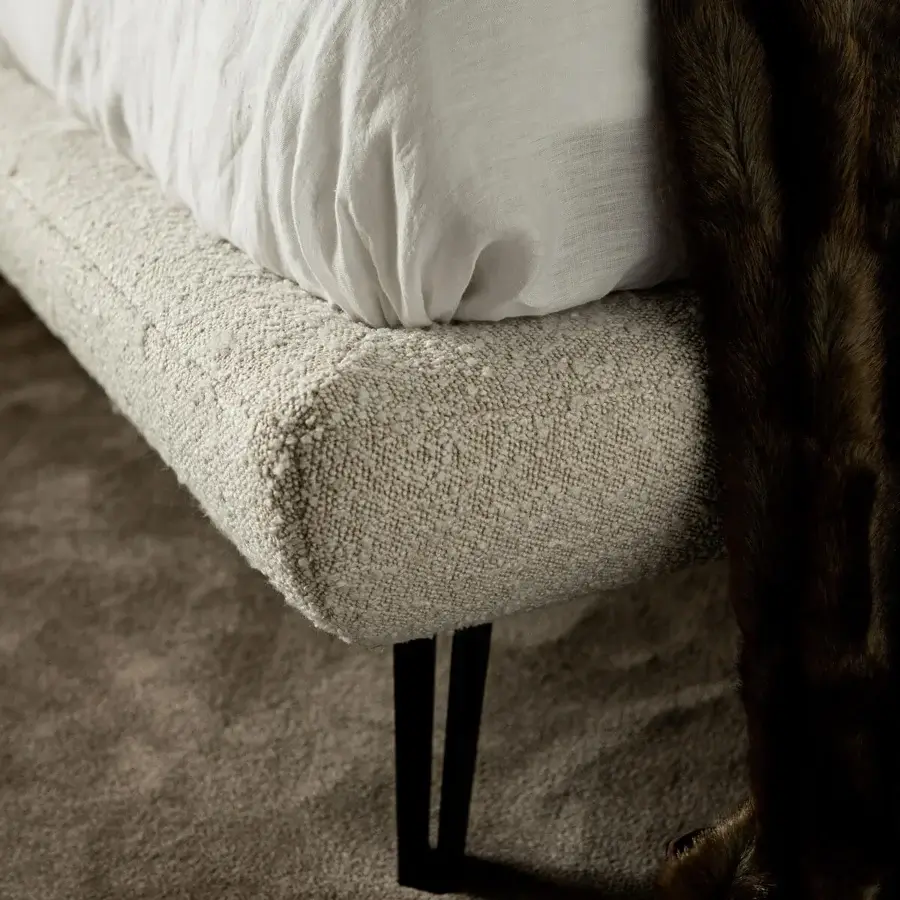 Superior Cattelan Italia Thomas bed with quilted light beige textile and dark matte metal legs