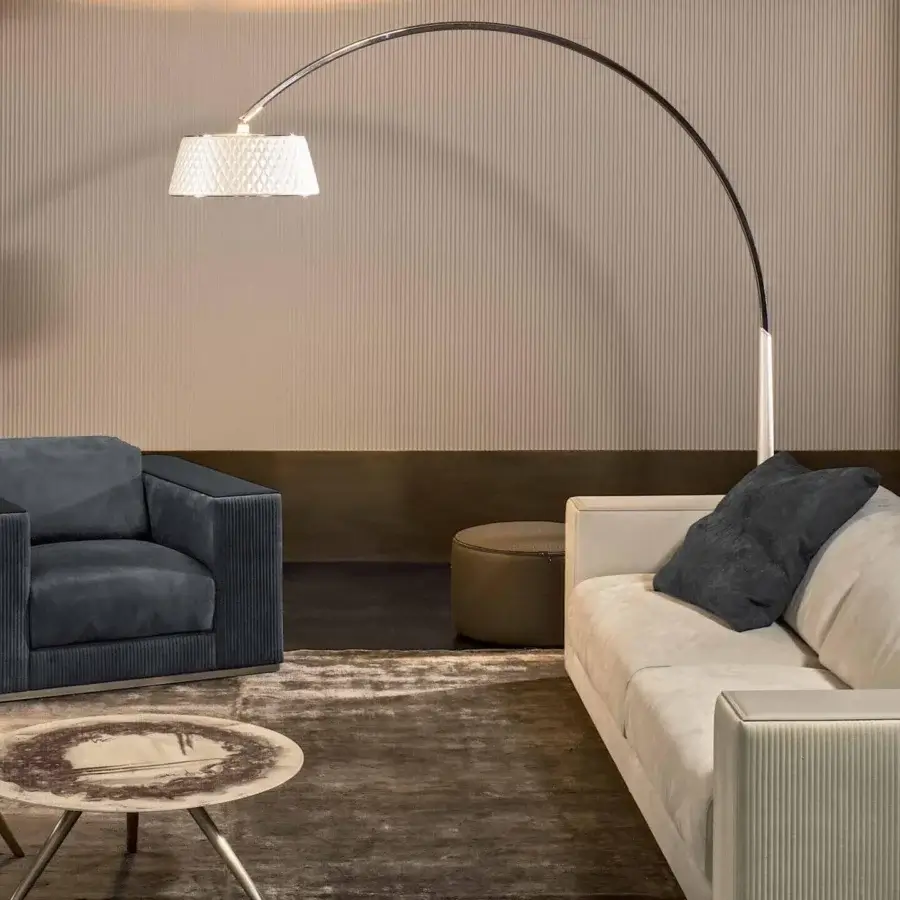 Distinguished Rugiano Vogue sofa upholstered in light beige fabric with a smooth finish and vertical ribbed detailing
