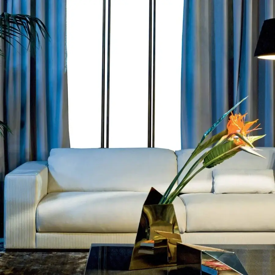 Exceptional Rugiano Vogue sofa, a two-seater upholstered in smooth off-white textile with distinctive vertical ribbed details