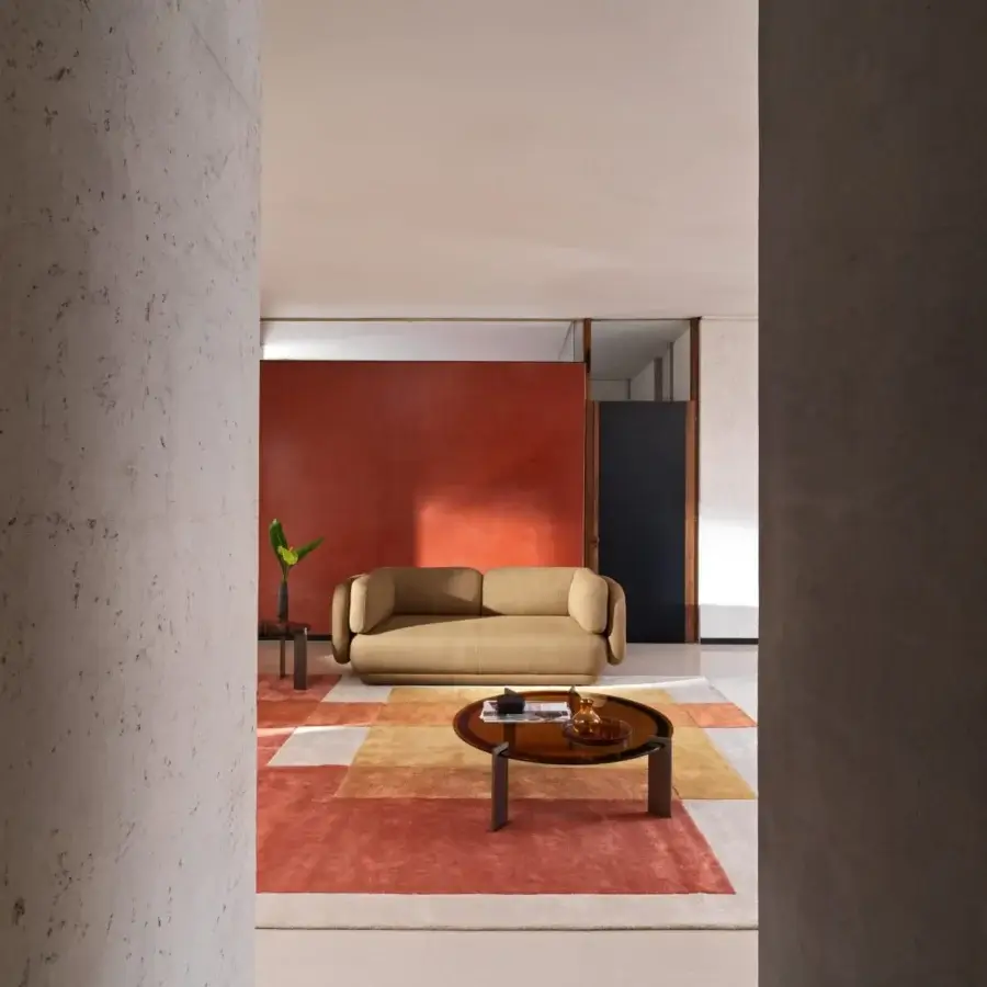 Elegant Ditre Italia Vento sofa with organic shapes and integrated armrests in matte light tan textile upholstery