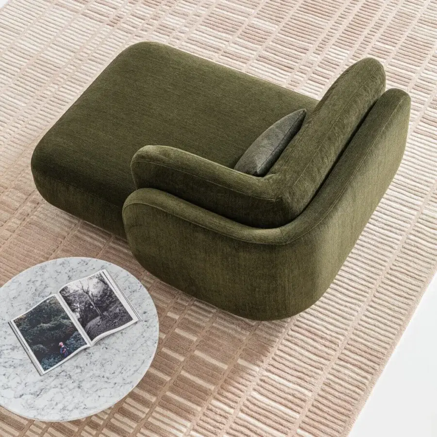 Superior Ditre Italia Vento chaise lounge with a curved form upholstered in muted olive green textile and textured matte finish