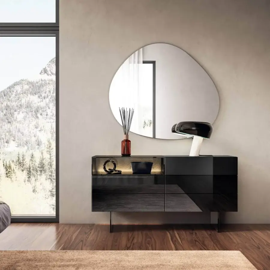 Distinguished Lago Pleasure mirror crafted in glossy glass with an organic asymmetrical shape and silver tone finish