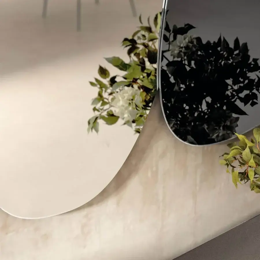 Superior Lago Melty mirror with overlapping silhouettes reflecting images in smooth glass with tinted finish