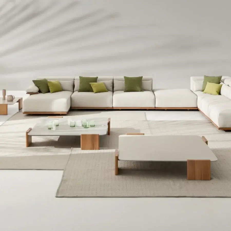 Lavish Ditre Italia Tao sectional in light cream textured fabric with shaped Iroko wood and green, yellow cushions