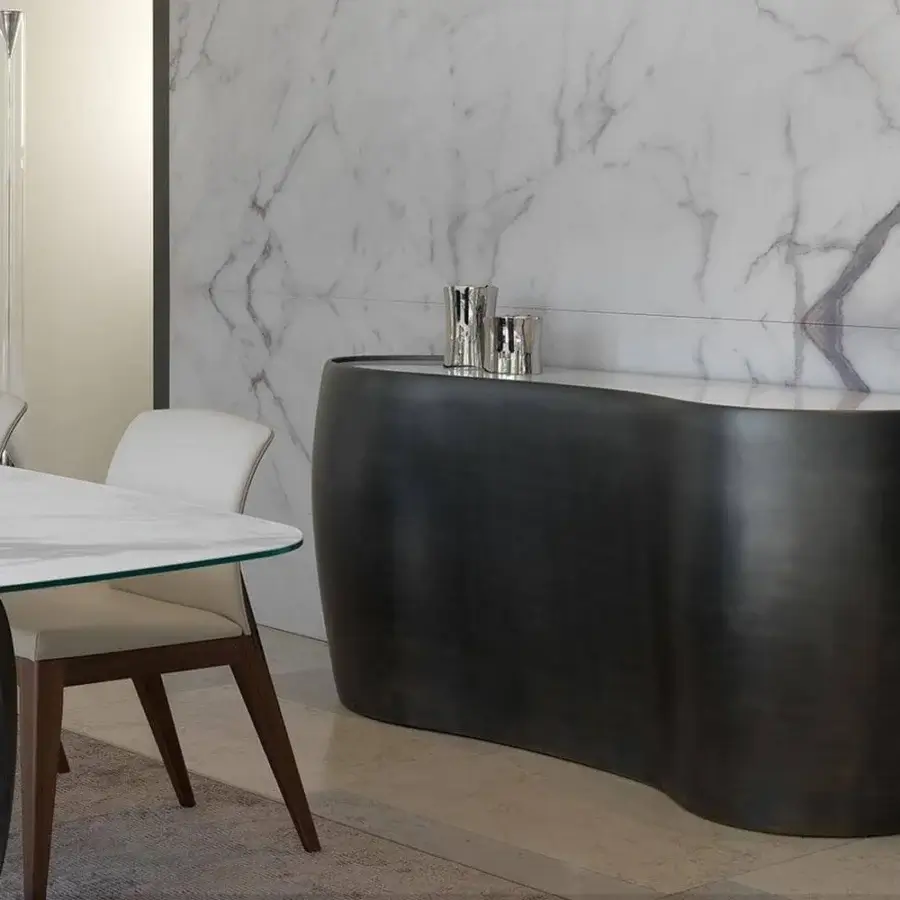 Exceptional Reflex Coco de Mer bar cabinet with curved silhouette in dark metal and light Marble glass with lacquered wood build