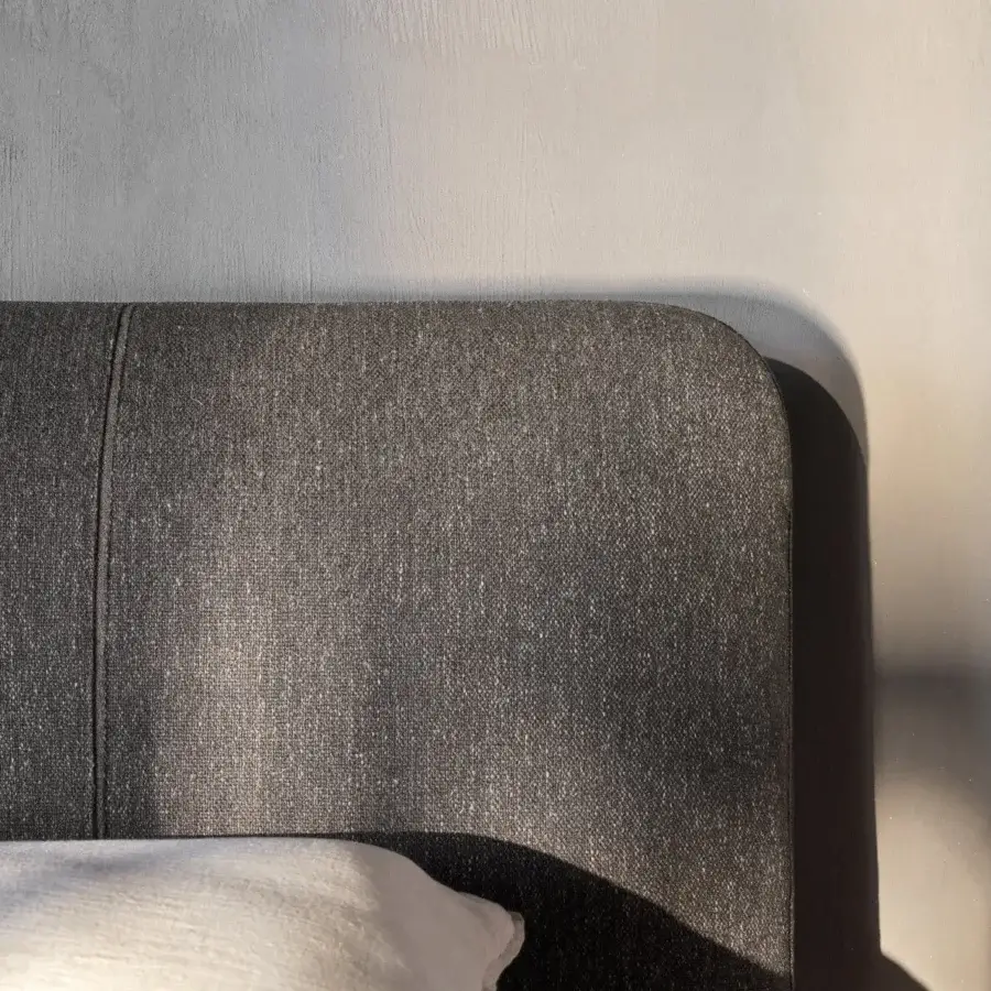 Sophisticated Ditre Italia Avalon bed with dark gray fabric upholstery and distinctive vertical seam detailing