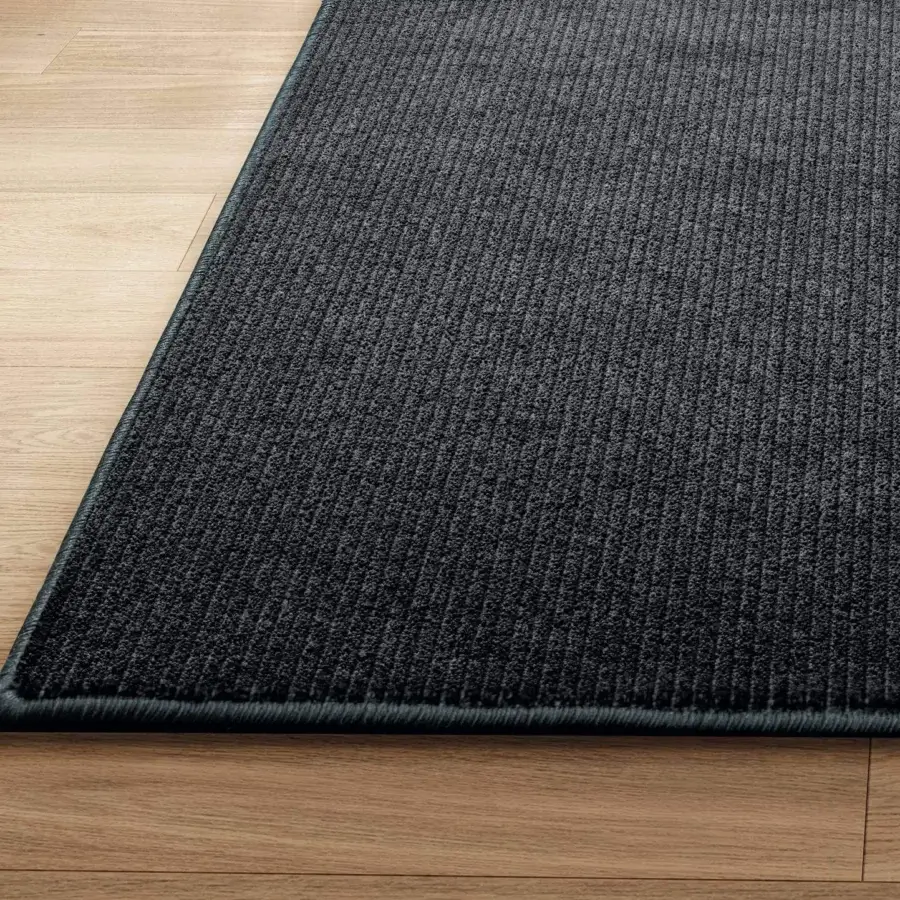 Distinguished Lago Kaya rug crafted in dark gray technical materials with a ribbed matte finish presents contemporary style