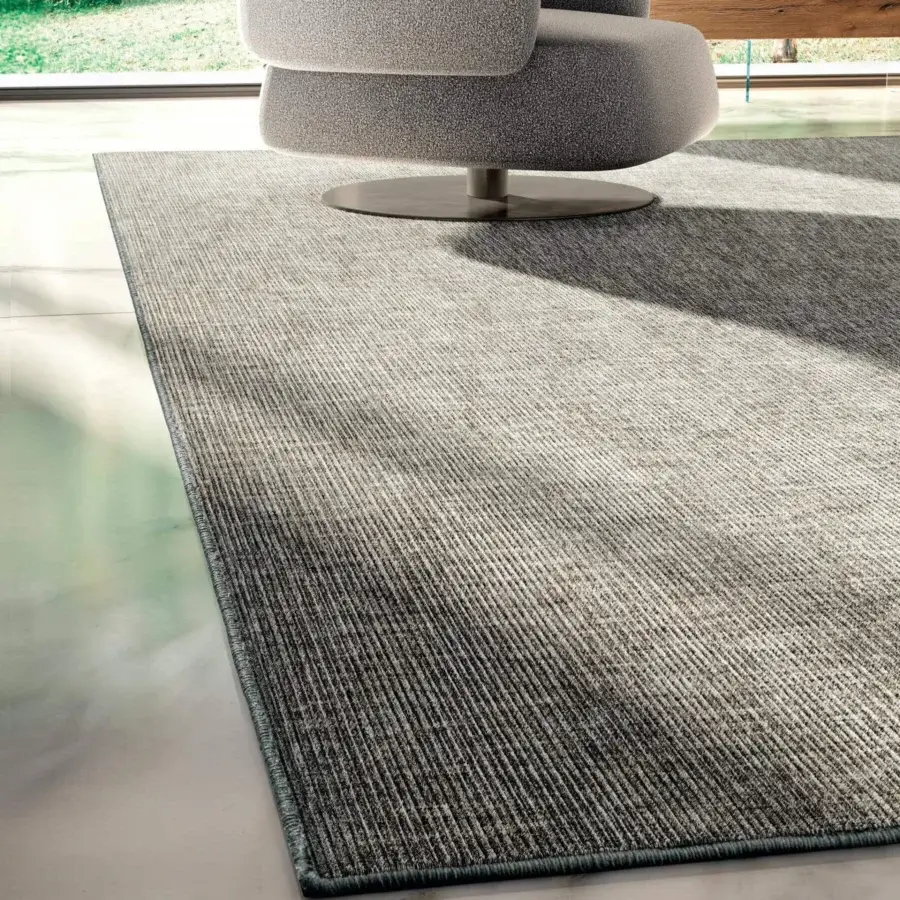 Exceptional Lago Suna rug with striated gray and off-white tones crafted from technical materials and presenting a matte finish