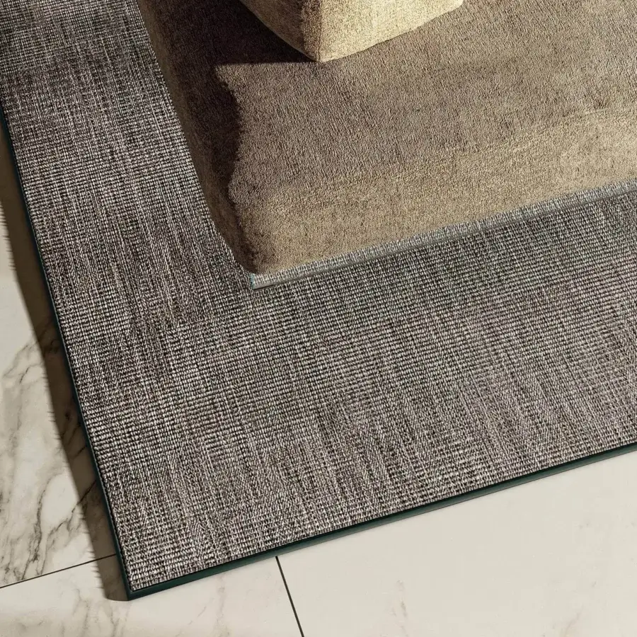 Distinguished Lago Suna rug crafted in Italy with heathered brown and gray tones plus a subtle dark green woven trim