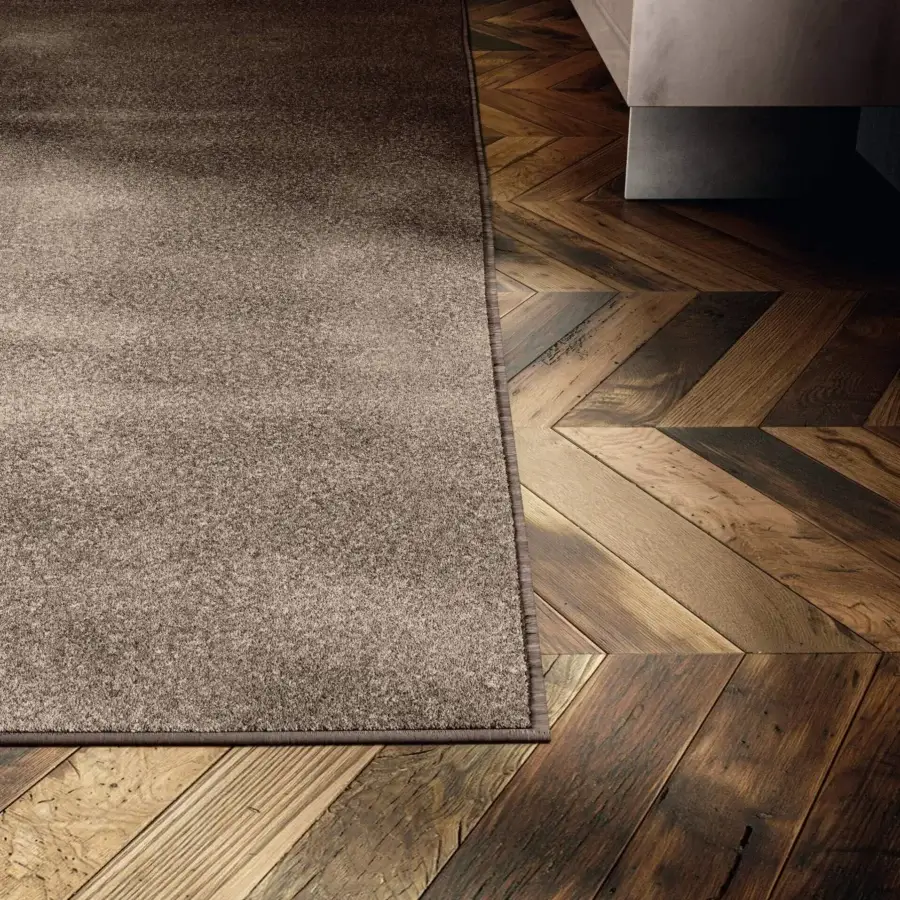 Distinguished Lago Diman rug crafted in Italy with uniform brown coloring and subtly textured matte finish