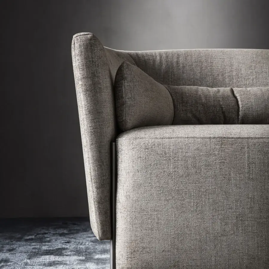 Lavish OAK Melodia lounge chair upholstered in textured gray-beige fabric with painted metal feet and detachable lumbar cushion