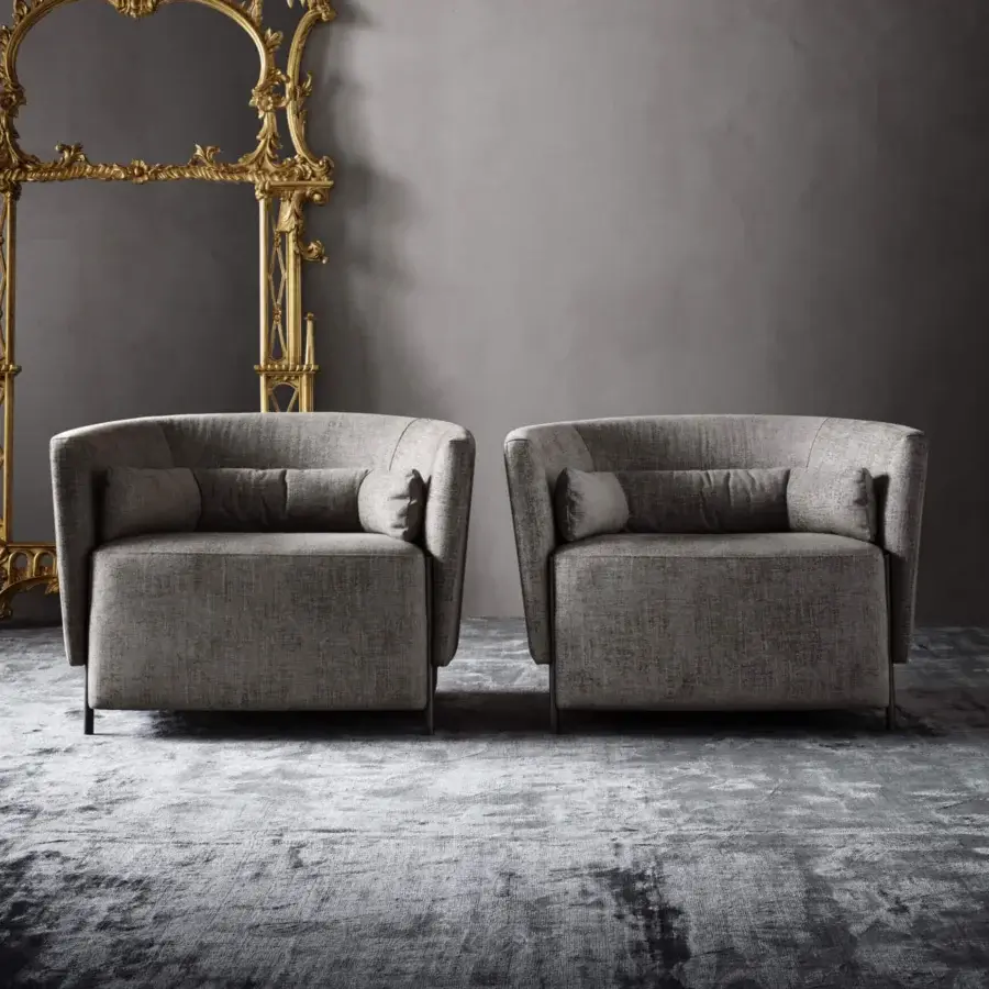 Exclusive OAK Melodia lounge chair upholstered in textured matte gray fabric with elegant dark metal feet and detachable lumbar support
