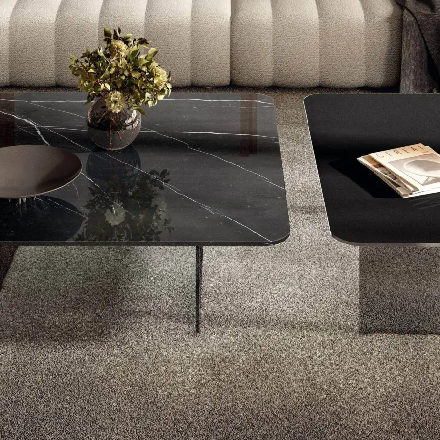 Superior Lago Air Soft coffee table with dark stone-like composite top and slender dark metal legs crafted in Italy
