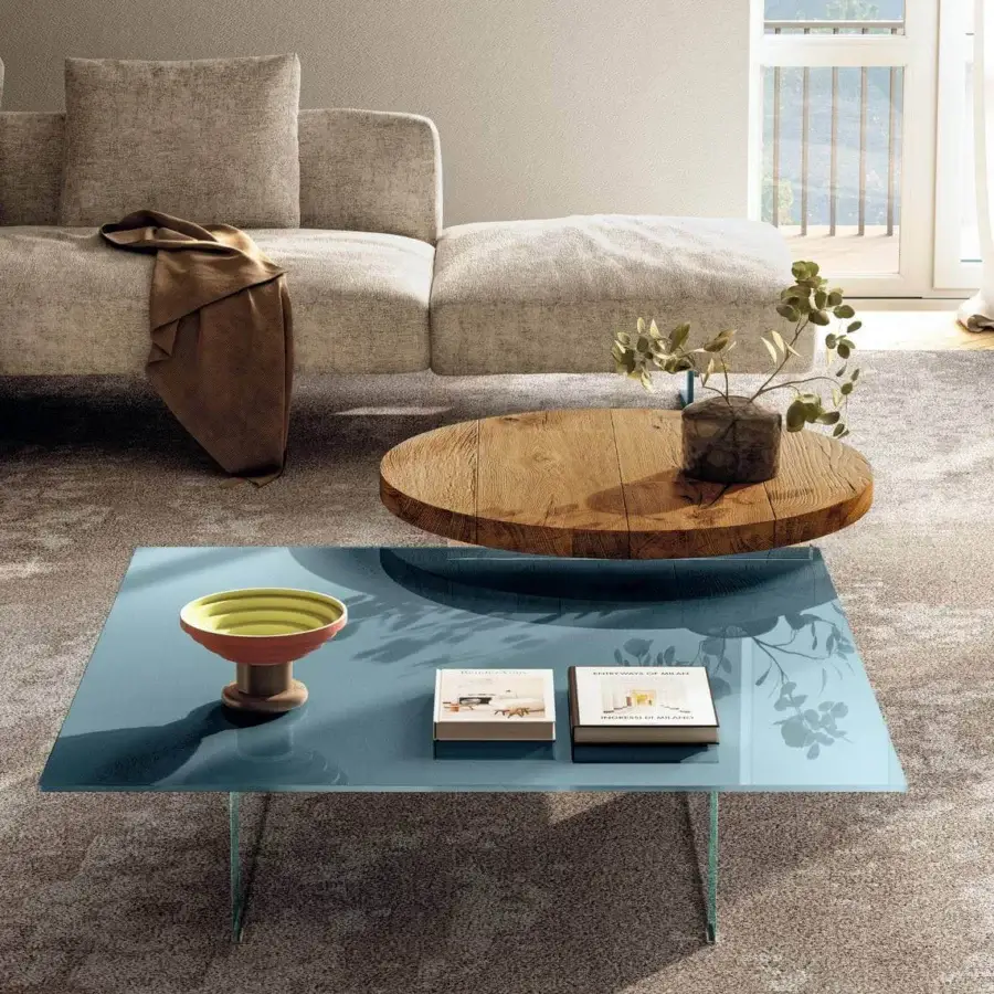 Distinguished Lago Air Round coffee table with light blue tinted glass top and transparent tempered glass legs crafted in Italy