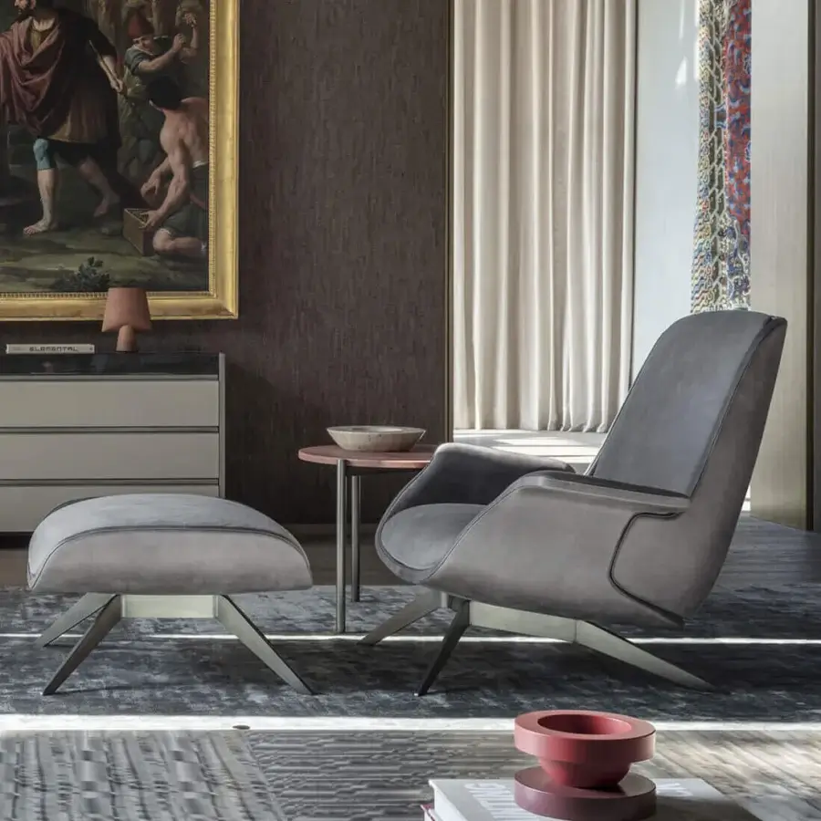 Exceptional OAK Blues lounge chair with curved silhouette, plush gray leather upholstery and painted metal base