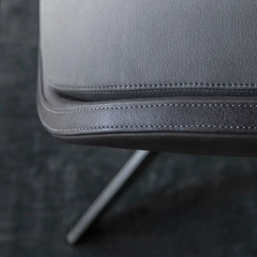 Superior OAK Blues lounge chair with muted gray leather upholstery and sleek painted metal base with matte finish