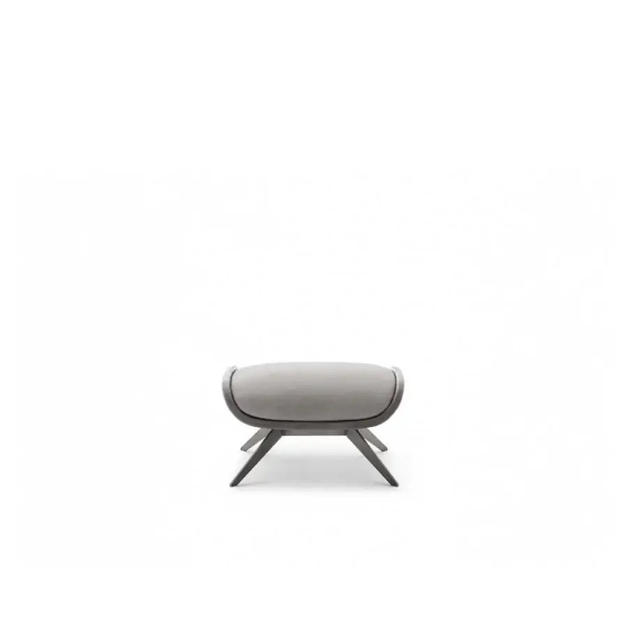 Exceptional OAK Blues lounge chair and pouf upholstered in smooth gray textile with a painted metal base