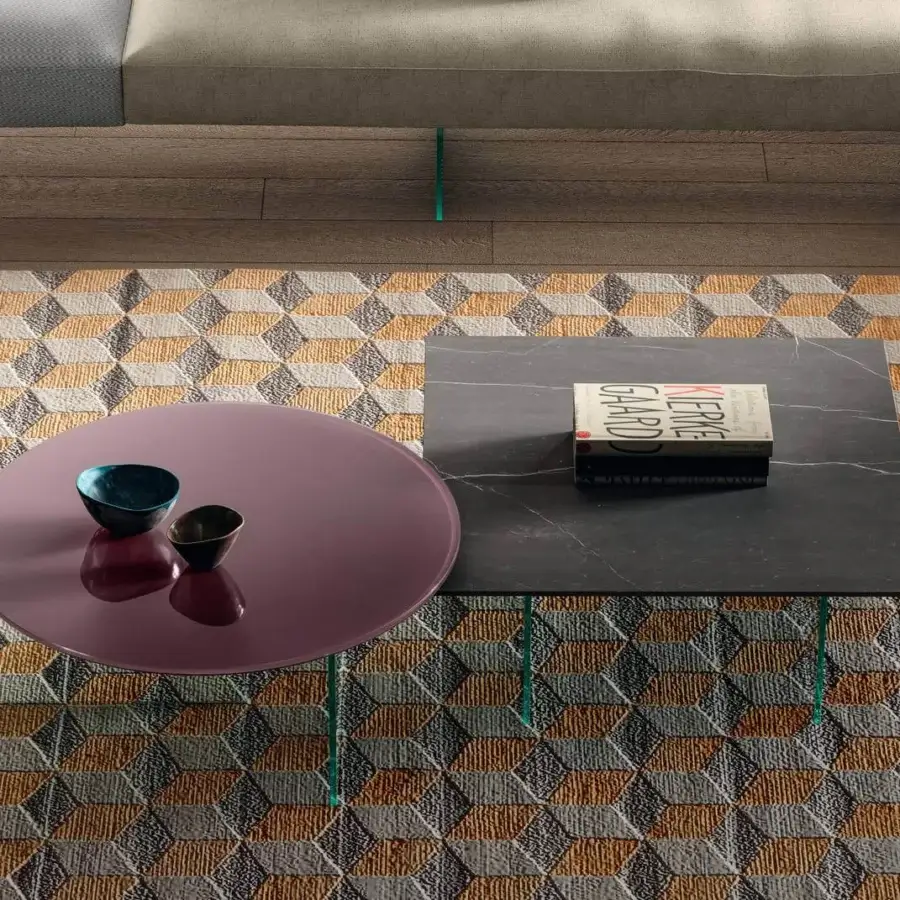 Elegant Lago Air Round Coffee Table with rose-colored glossy tabletop and transparent tempered glass legs