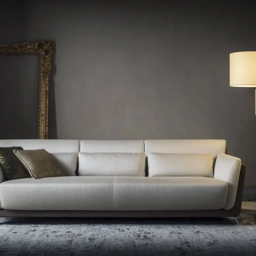 Sophisticated OAK Moma sofa with light gray textile upholstery and a dark brown base complemented by olive green and shiny bronze cushions