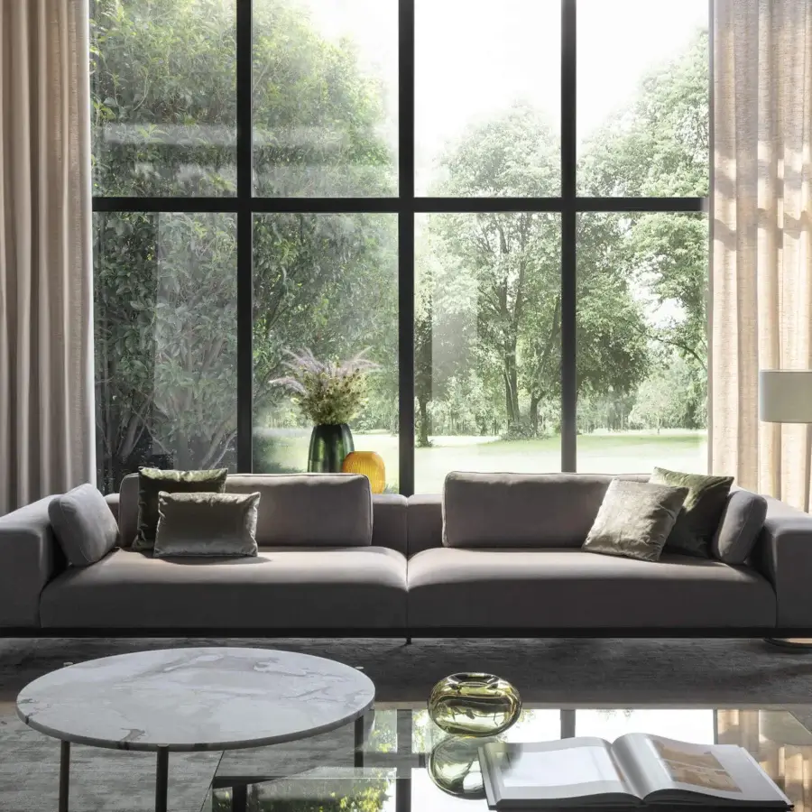 Captivating OAK Opera sofa with smooth light gray fabric upholstery and dark metal carter base with plush green cushions