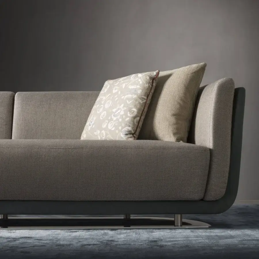 Architectural OAK Solomon sofa with enveloping shape upholstered in textured gray-beige fabric and dark synthetic base