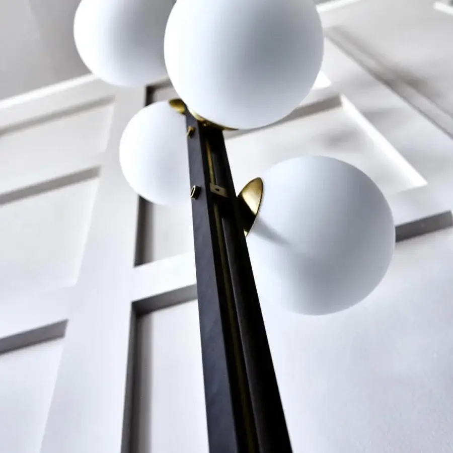 Elegant Cattelan Italia Planeta floor lamp with burnished steel frame and satin white blown glass spheres in brushed brass detailing