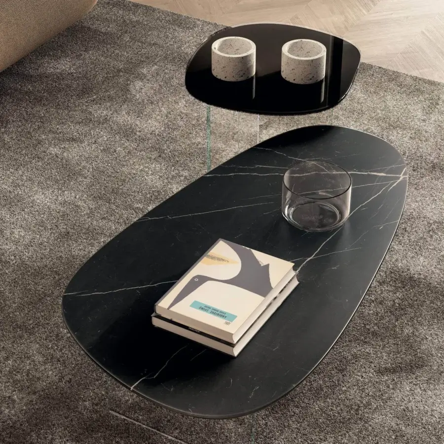 Exceptional Lago Pleasure coffee table with irregular curved forms in glossy black XGlass marble and transparent glass legs