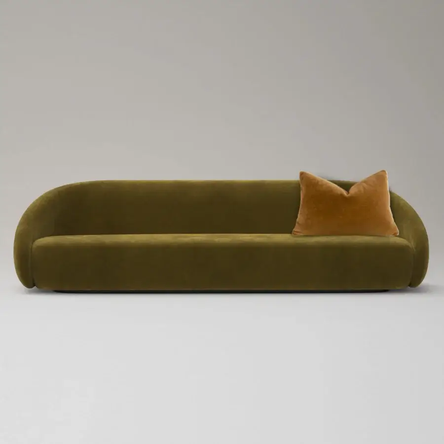Harmonious LaCividina Apper sofa with a curved silhouette upholstered in tactile olive green fabric and a single orange throw pillow