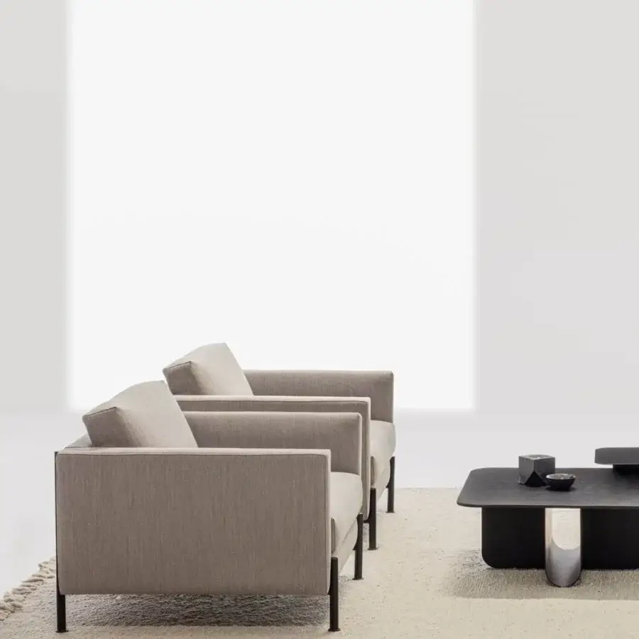 Captivating LaCividina Newtime lounge chair in light neutral textile with slim dark metal feet and matte finish