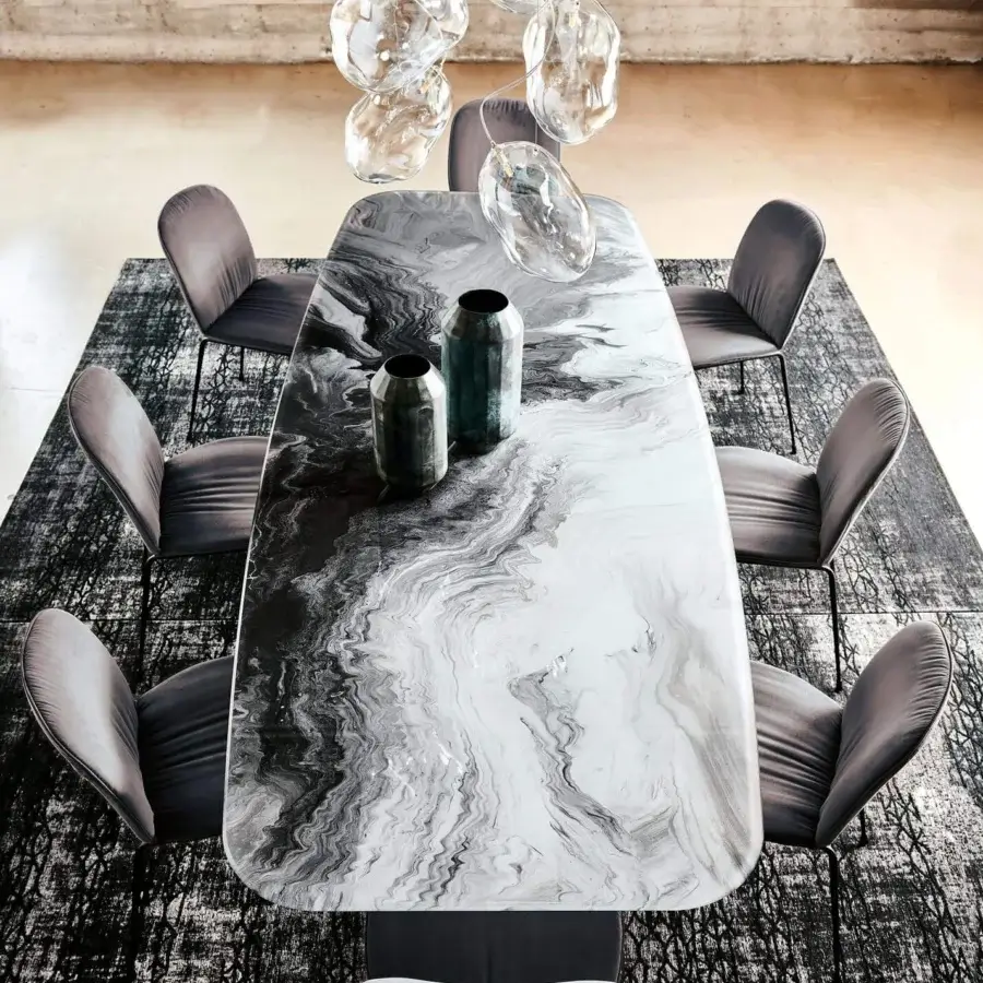 Distinguished Cattelan Italia Stratos table with extra clear beveled glass exhibiting swirling white, gray and black marbling in a graphite embossed lacquered steel base