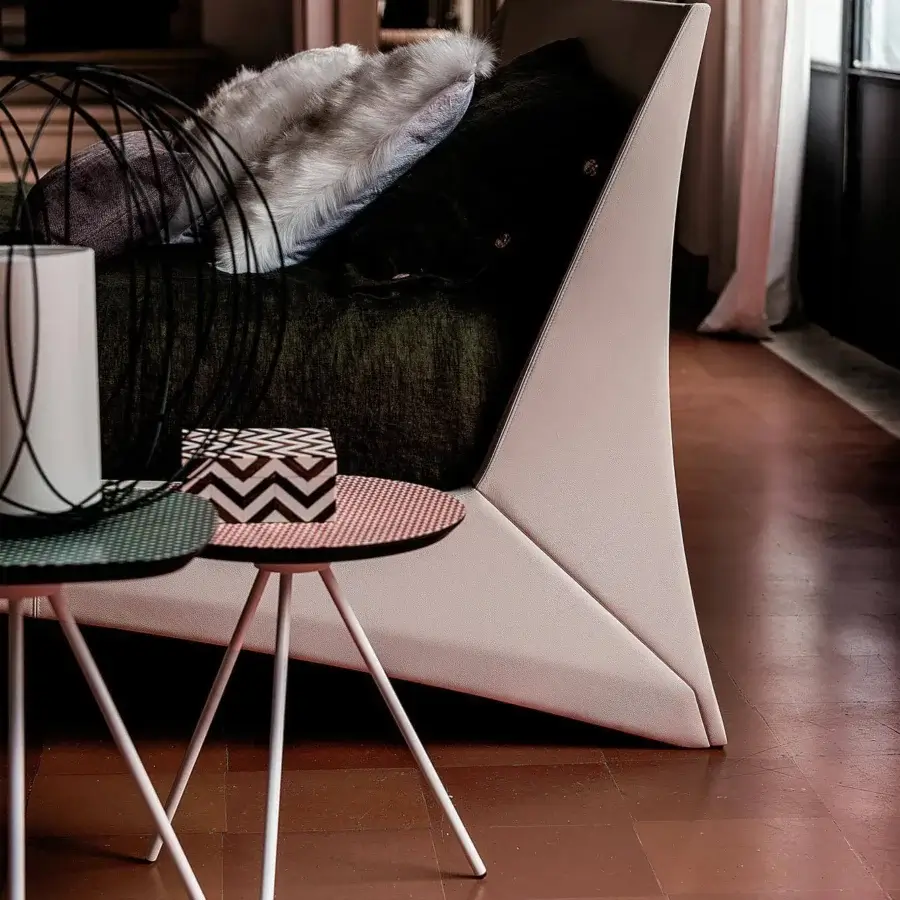 Distinguished Cattelan Italia Dylan bed upholstered in light beige fabric with chromed steel feet and angular headboard design