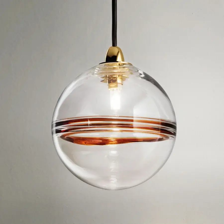 Exclusive Vistosi Oro suspension lamp in transparent crystal glass with glossy brass metal and amber membrane