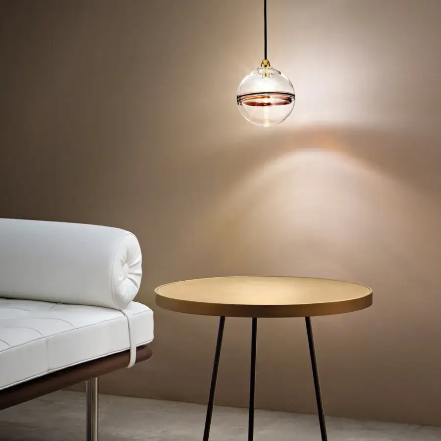 Captivating Vistosi Oro suspension lamp in crystal glass with glossy brass metal parts and a dark horizontal membrane