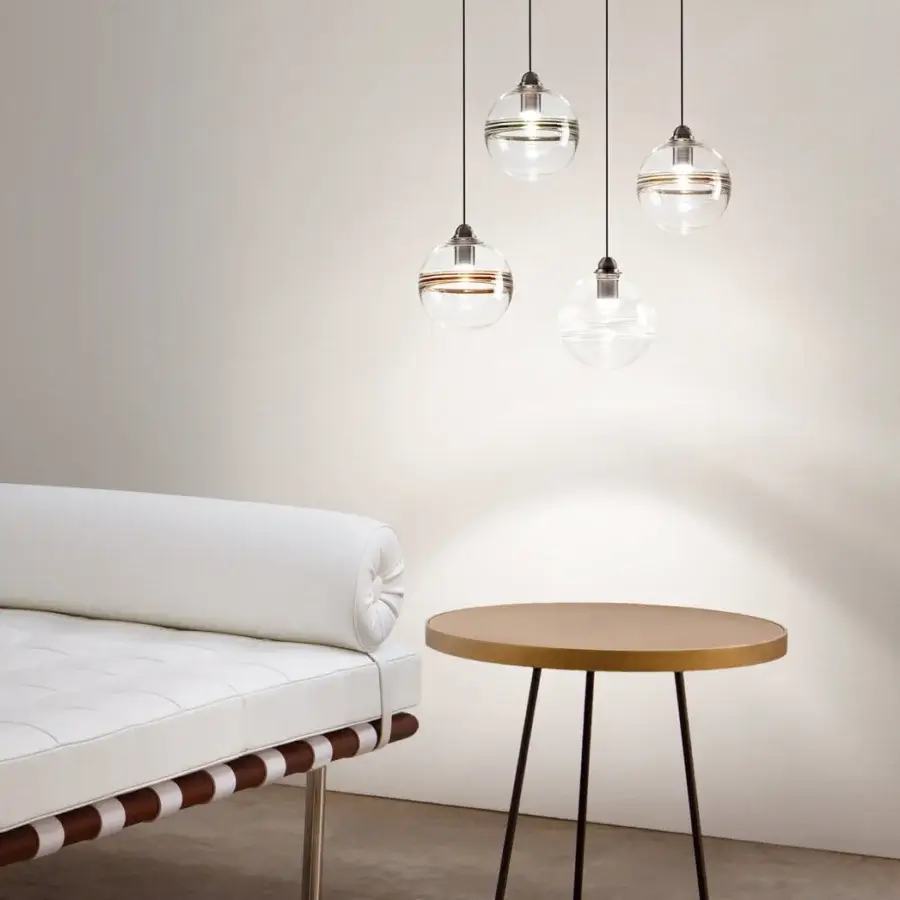 Elegant Vistosi Oro suspension lamp in crystal glass bisected with a glossy brass horizontal band and sleek black cord