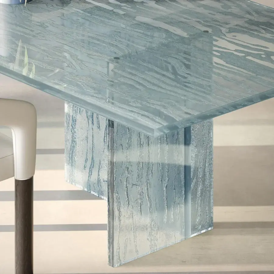 Exceptional Reflex Laguna table with a light blue-grey glass top and base crafted with a unique molten texture