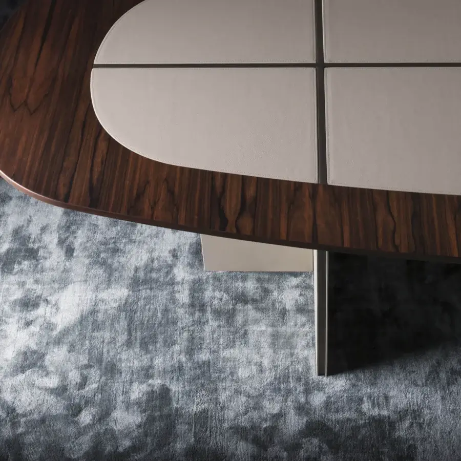 Distinguished OAK Sinfonia table with light beige leather inserts bordered by dark wood and a veneered leg
