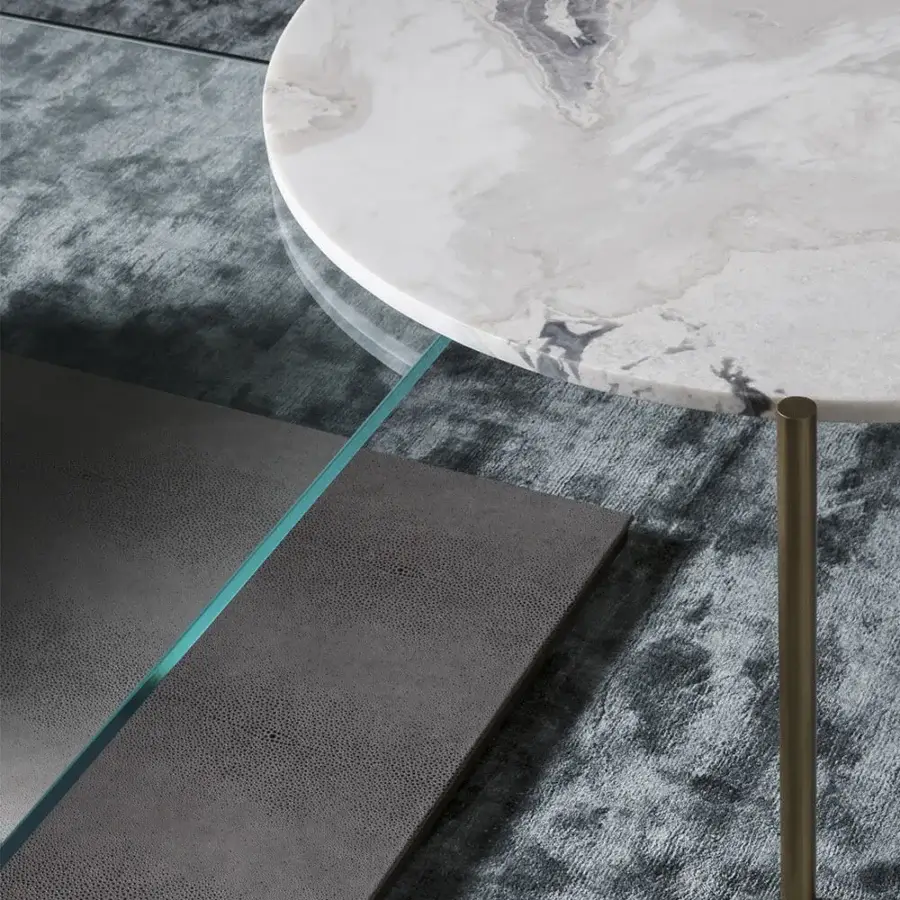 Captivating OAK Ritmo coffee table with round marble top exhibiting delicate grey veining and slender brass tone metal leg