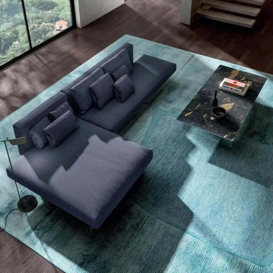 Superior Lago Air sectional with deep blue textile, matte finish and extra-clear tempered glass legs